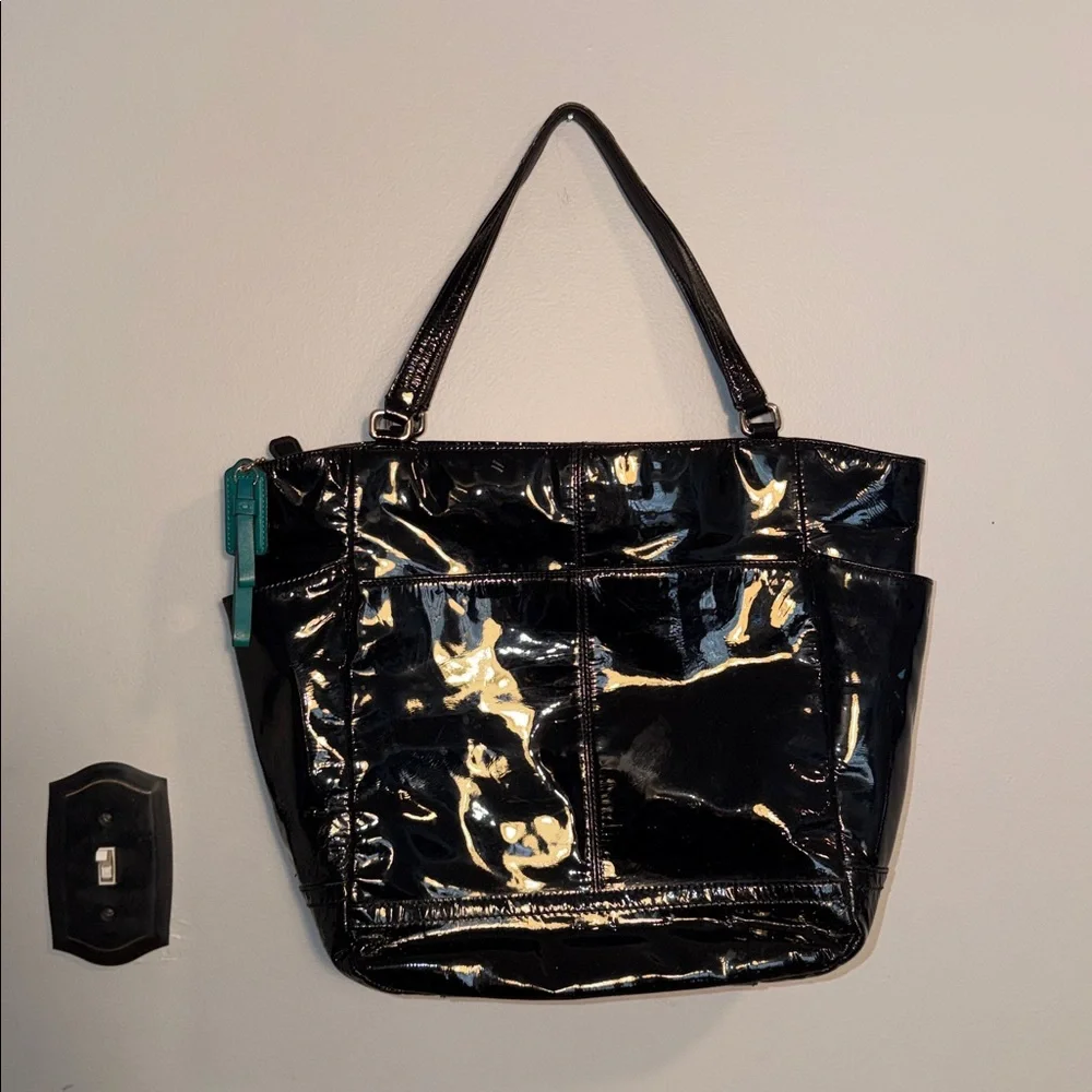Coach ladies black patent leather tote. Green lining. F24893.